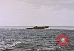 Image of USS Cod (SS-224) fires at Dutch submarine, O-19, to scuttle her Spratly Islands, 1945, second 5 stock footage video 65675076089