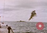 Image of USS Cod (SS-224) fires at Dutch submarine, O-19, to scuttle her Spratly Islands, 1945, second 10 stock footage video 65675076089