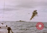 Image of USS Cod (SS-224) fires at Dutch submarine, O-19, to scuttle her Spratly Islands, 1945, second 11 stock footage video 65675076089