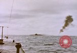 Image of USS Cod (SS-224) fires at Dutch submarine, O-19, to scuttle her Spratly Islands, 1945, second 14 stock footage video 65675076089