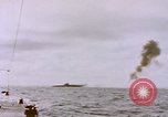 Image of USS Cod (SS-224) fires at Dutch submarine, O-19, to scuttle her Spratly Islands, 1945, second 16 stock footage video 65675076089