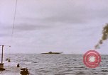 Image of USS Cod (SS-224) fires at Dutch submarine, O-19, to scuttle her Spratly Islands, 1945, second 17 stock footage video 65675076089