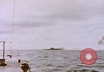 Image of USS Cod (SS-224) fires at Dutch submarine, O-19, to scuttle her Spratly Islands, 1945, second 18 stock footage video 65675076089