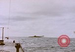 Image of USS Cod (SS-224) fires at Dutch submarine, O-19, to scuttle her Spratly Islands, 1945, second 20 stock footage video 65675076089