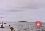 Image of USS Cod (SS-224) fires at Dutch submarine, O-19, to scuttle her Spratly Islands, 1945, second 21 stock footage video 65675076089