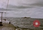 Image of USS Cod (SS-224) fires at Dutch submarine, O-19, to scuttle her Spratly Islands, 1945, second 23 stock footage video 65675076089