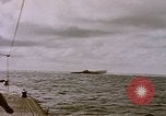 Image of USS Cod (SS-224) fires at Dutch submarine, O-19, to scuttle her Spratly Islands, 1945, second 25 stock footage video 65675076089
