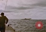 Image of USS Cod (SS-224) fires at Dutch submarine, O-19, to scuttle her Spratly Islands, 1945, second 26 stock footage video 65675076089