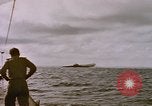Image of USS Cod (SS-224) fires at Dutch submarine, O-19, to scuttle her Spratly Islands, 1945, second 27 stock footage video 65675076089