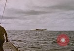 Image of USS Cod (SS-224) fires at Dutch submarine, O-19, to scuttle her Spratly Islands, 1945, second 28 stock footage video 65675076089