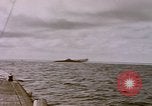 Image of USS Cod (SS-224) fires at Dutch submarine, O-19, to scuttle her Spratly Islands, 1945, second 30 stock footage video 65675076089