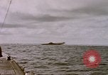 Image of USS Cod (SS-224) fires at Dutch submarine, O-19, to scuttle her Spratly Islands, 1945, second 31 stock footage video 65675076089