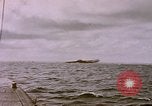 Image of USS Cod (SS-224) fires at Dutch submarine, O-19, to scuttle her Spratly Islands, 1945, second 33 stock footage video 65675076089