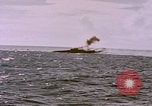 Image of USS Cod (SS-224) fires at Dutch submarine, O-19, to scuttle her Spratly Islands, 1945, second 34 stock footage video 65675076089