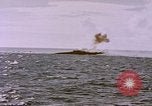 Image of USS Cod (SS-224) fires at Dutch submarine, O-19, to scuttle her Spratly Islands, 1945, second 35 stock footage video 65675076089