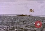 Image of USS Cod (SS-224) fires at Dutch submarine, O-19, to scuttle her Spratly Islands, 1945, second 36 stock footage video 65675076089