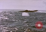 Image of USS Cod (SS-224) fires at Dutch submarine, O-19, to scuttle her Spratly Islands, 1945, second 37 stock footage video 65675076089