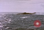 Image of USS Cod (SS-224) fires at Dutch submarine, O-19, to scuttle her Spratly Islands, 1945, second 38 stock footage video 65675076089