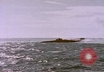 Image of USS Cod (SS-224) fires at Dutch submarine, O-19, to scuttle her Spratly Islands, 1945, second 40 stock footage video 65675076089