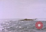 Image of USS Cod (SS-224) fires at Dutch submarine, O-19, to scuttle her Spratly Islands, 1945, second 42 stock footage video 65675076089