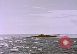 Image of USS Cod (SS-224) fires at Dutch submarine, O-19, to scuttle her Spratly Islands, 1945, second 44 stock footage video 65675076089