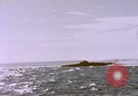 Image of USS Cod (SS-224) fires at Dutch submarine, O-19, to scuttle her Spratly Islands, 1945, second 45 stock footage video 65675076089