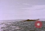 Image of USS Cod (SS-224) fires at Dutch submarine, O-19, to scuttle her Spratly Islands, 1945, second 46 stock footage video 65675076089