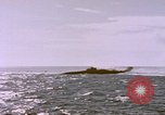 Image of USS Cod (SS-224) fires at Dutch submarine, O-19, to scuttle her Spratly Islands, 1945, second 48 stock footage video 65675076089