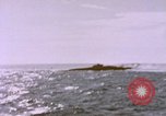 Image of USS Cod (SS-224) fires at Dutch submarine, O-19, to scuttle her Spratly Islands, 1945, second 49 stock footage video 65675076089