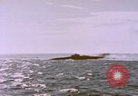 Image of USS Cod (SS-224) fires at Dutch submarine, O-19, to scuttle her Spratly Islands, 1945, second 50 stock footage video 65675076089