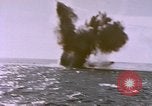 Image of USS Cod (SS-224) fires at Dutch submarine, O-19, to scuttle her Spratly Islands, 1945, second 52 stock footage video 65675076089