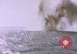 Image of USS Cod (SS-224) fires at Dutch submarine, O-19, to scuttle her Spratly Islands, 1945, second 55 stock footage video 65675076089