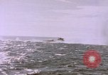 Image of USS Cod (SS-224) fires at Dutch submarine, O-19, to scuttle her Spratly Islands, 1945, second 56 stock footage video 65675076089