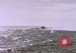 Image of USS Cod (SS-224) fires at Dutch submarine, O-19, to scuttle her Spratly Islands, 1945, second 58 stock footage video 65675076089