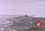 Image of USS Cod (SS-224) fires at Dutch submarine, O-19, to scuttle her Spratly Islands, 1945, second 60 stock footage video 65675076089
