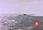 Image of USS Cod (SS-224) fires at Dutch submarine, O-19, to scuttle her Spratly Islands, 1945, second 61 stock footage video 65675076089