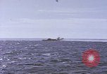 Image of USS Cod fires deck gun in actions to scuttle Dutch submarine, O-19 Spratly Islands, 1945, second 4 stock footage video 65675076091