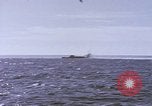 Image of USS Cod fires deck gun in actions to scuttle Dutch submarine, O-19 Spratly Islands, 1945, second 5 stock footage video 65675076091