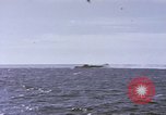 Image of USS Cod fires deck gun in actions to scuttle Dutch submarine, O-19 Spratly Islands, 1945, second 7 stock footage video 65675076091