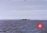 Image of USS Cod fires deck gun in actions to scuttle Dutch submarine, O-19 Spratly Islands, 1945, second 8 stock footage video 65675076091
