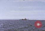Image of USS Cod fires deck gun in actions to scuttle Dutch submarine, O-19 Spratly Islands, 1945, second 9 stock footage video 65675076091