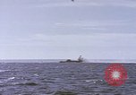 Image of USS Cod fires deck gun in actions to scuttle Dutch submarine, O-19 Spratly Islands, 1945, second 10 stock footage video 65675076091