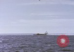 Image of USS Cod fires deck gun in actions to scuttle Dutch submarine, O-19 Spratly Islands, 1945, second 11 stock footage video 65675076091