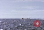 Image of USS Cod fires deck gun in actions to scuttle Dutch submarine, O-19 Spratly Islands, 1945, second 13 stock footage video 65675076091