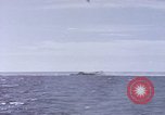 Image of USS Cod fires deck gun in actions to scuttle Dutch submarine, O-19 Spratly Islands, 1945, second 15 stock footage video 65675076091