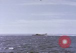 Image of USS Cod fires deck gun in actions to scuttle Dutch submarine, O-19 Spratly Islands, 1945, second 16 stock footage video 65675076091