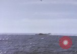 Image of USS Cod fires deck gun in actions to scuttle Dutch submarine, O-19 Spratly Islands, 1945, second 17 stock footage video 65675076091