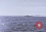 Image of USS Cod fires deck gun in actions to scuttle Dutch submarine, O-19 Spratly Islands, 1945, second 18 stock footage video 65675076091