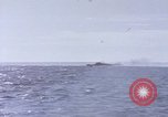 Image of USS Cod fires deck gun in actions to scuttle Dutch submarine, O-19 Spratly Islands, 1945, second 19 stock footage video 65675076091