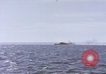 Image of USS Cod fires deck gun in actions to scuttle Dutch submarine, O-19 Spratly Islands, 1945, second 21 stock footage video 65675076091